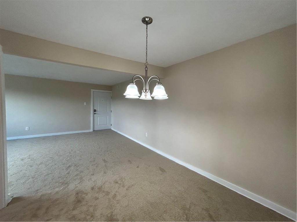 5900 Babcock Boulevard, Unit 35 Pittsburgh, PA 15237 - Photo 6 of 15 a view of a room with a hanging light and kitchen