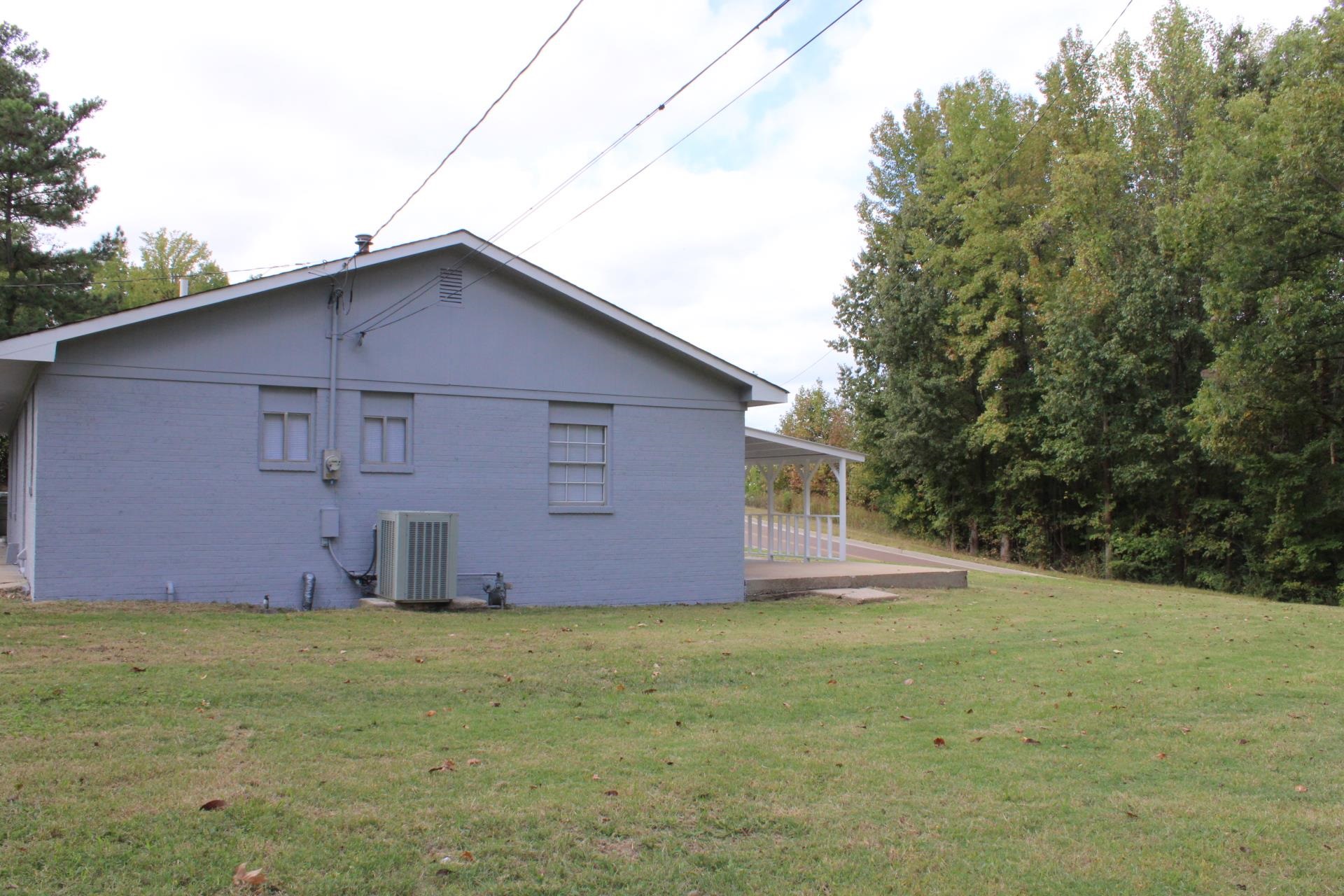 138 West Webb Avenue Ripley, TN 38063 - Photo 7 of 31 a house with trees in front of it