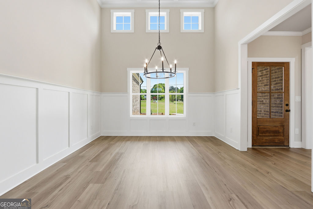 720 Youth Jersey Road Loganville, GA 30052 - Photo 14 of 31 wooden floor in an empty room with a window