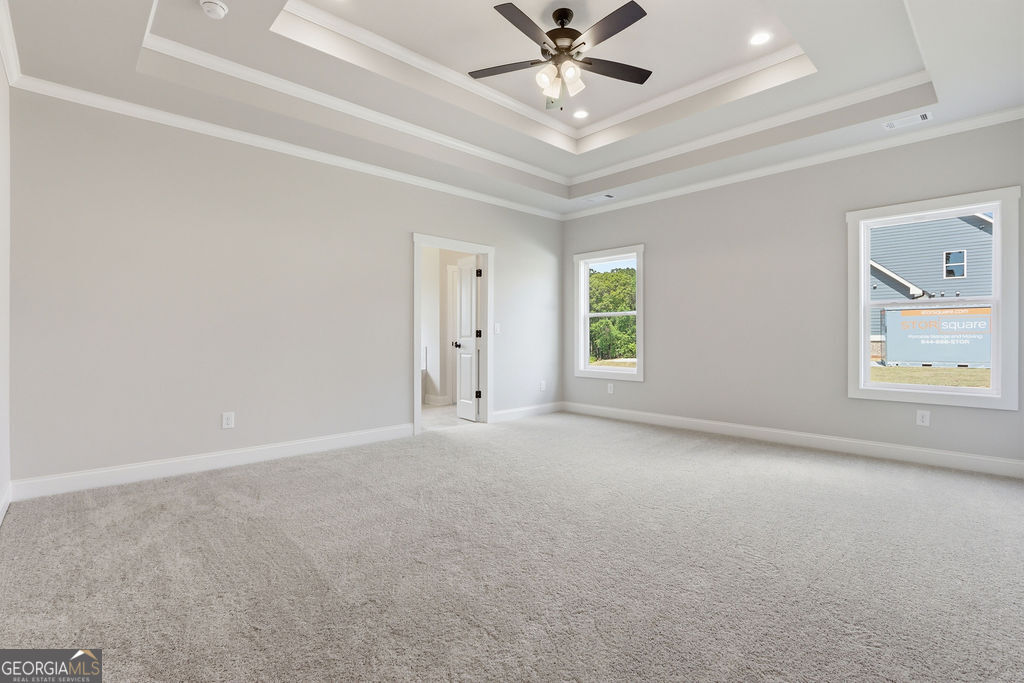 720 Youth Jersey Road Loganville, GA 30052 - Photo 15 of 31 an empty room with windows and fan