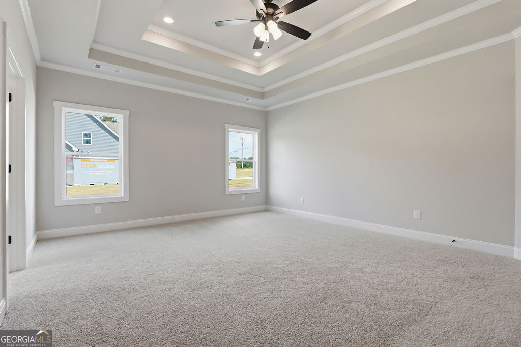 720 Youth Jersey Road Loganville, GA 30052 - Photo 17 of 31 an empty room with windows and fan