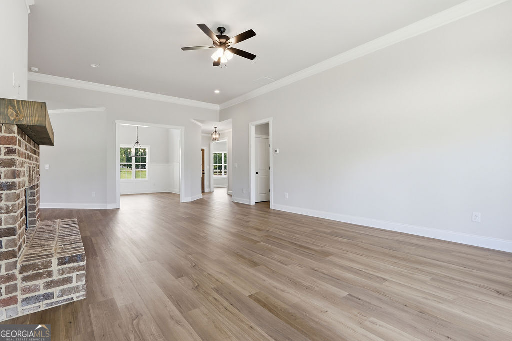 720 Youth Jersey Road Loganville, GA 30052 - Photo 8 of 31 wooden floor in an empty room with a window