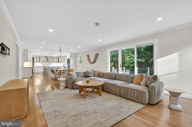 a view of a dining room with furniture wooden floor and chandelier