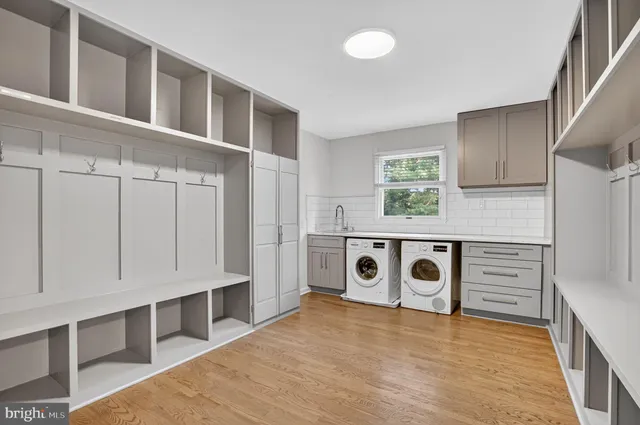 a bedroom with a large bed and a dresser