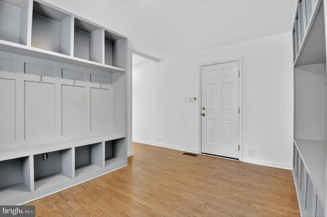 a bedroom with a large bed and a dresser