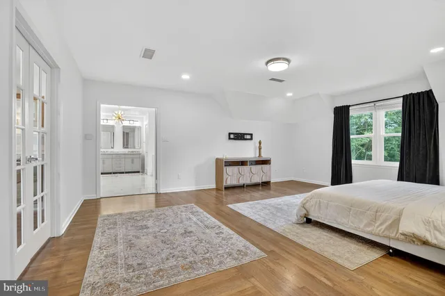 a bathroom with a double vanity sink mirror and shower