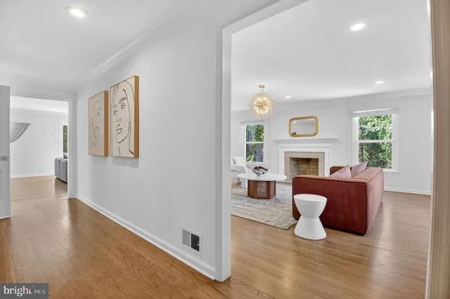 a living room with furniture and lamp