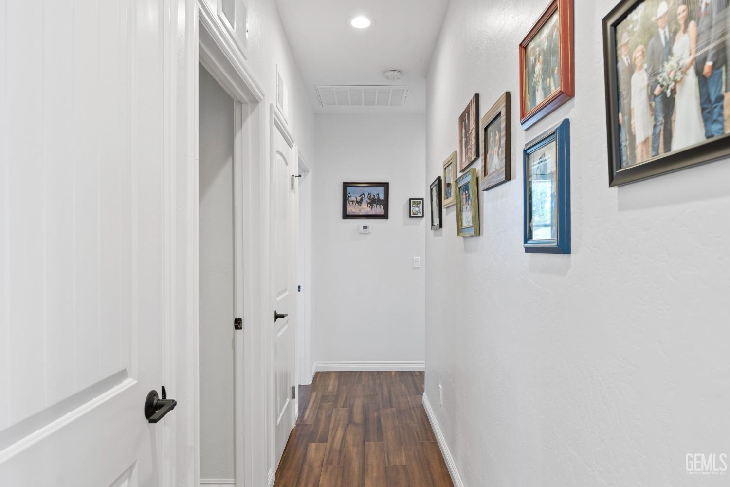 Undisclosed Address Tehachapi, CA 93561 - Photo 18 of 41 a view of a hallway with wooden floor and entryway