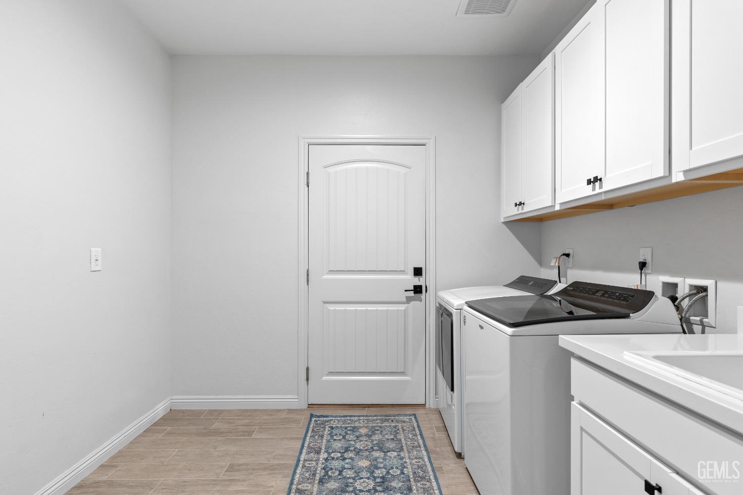 Undisclosed Address Tehachapi, CA 93561 - Photo 19 of 41 a kitchen with a sink and cabinets