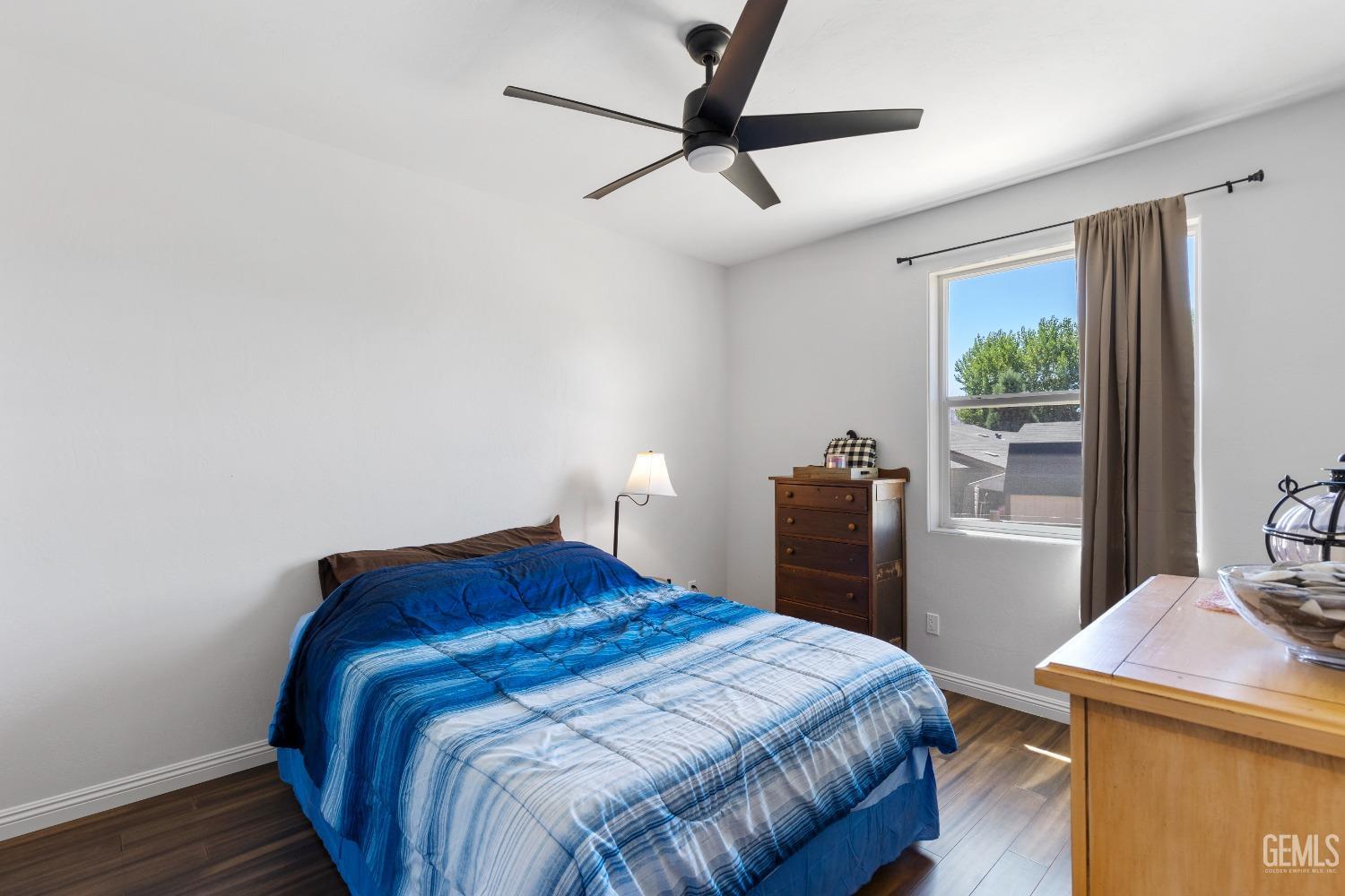 Undisclosed Address Tehachapi, CA 93561 - Photo 20 of 41 a bedroom with a bed and a window
