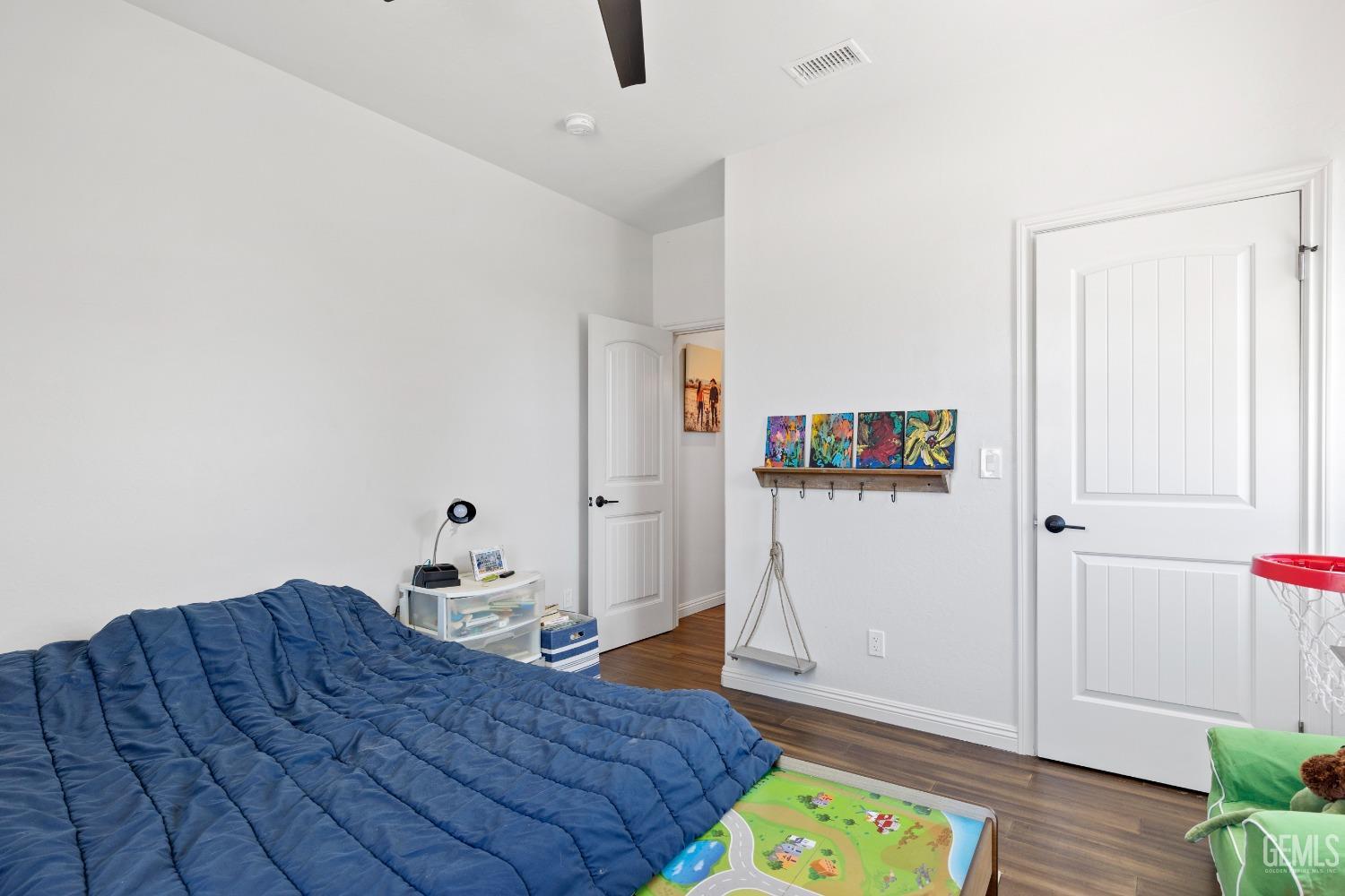 Undisclosed Address Tehachapi, CA 93561 - Photo 24 of 41 a bedroom with a bed and a window