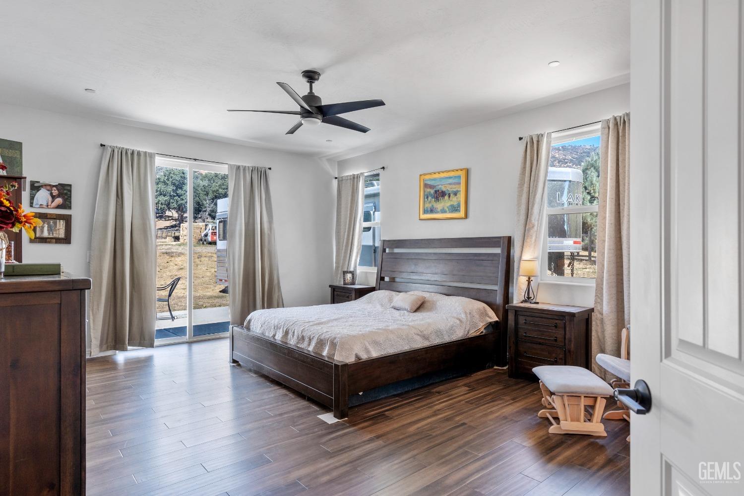 Undisclosed Address Tehachapi, CA 93561 - Photo 25 of 41 a bedroom with a bed and wooden floor