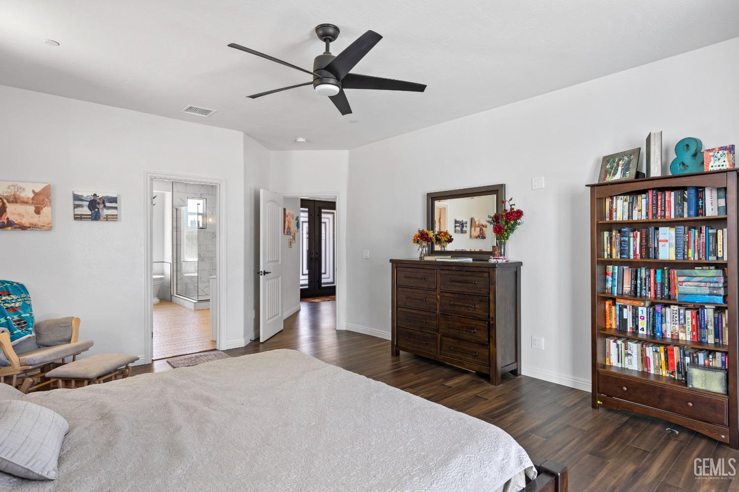 Undisclosed Address Tehachapi, CA 93561 - Photo 27 of 41 a bedroom with a bed and a book shelf