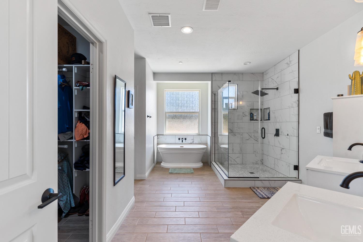 Undisclosed Address Tehachapi, CA 93561 - Photo 28 of 41 a bathroom with a tub shower and mirror