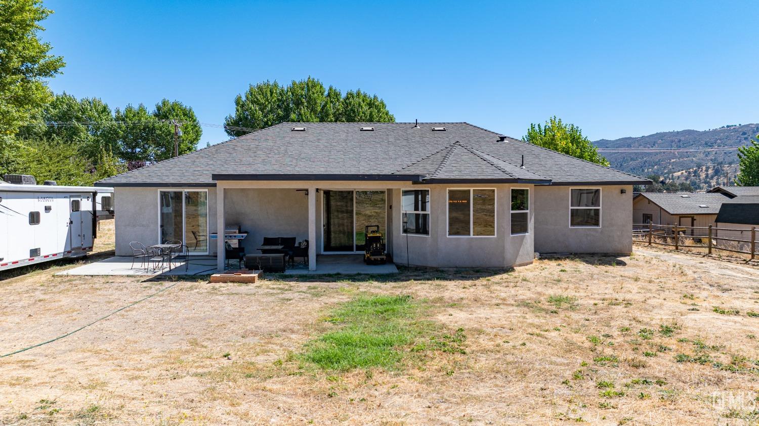 Undisclosed Address Tehachapi, CA 93561 - Photo 33 of 41 a front view of a house with yard and seating space