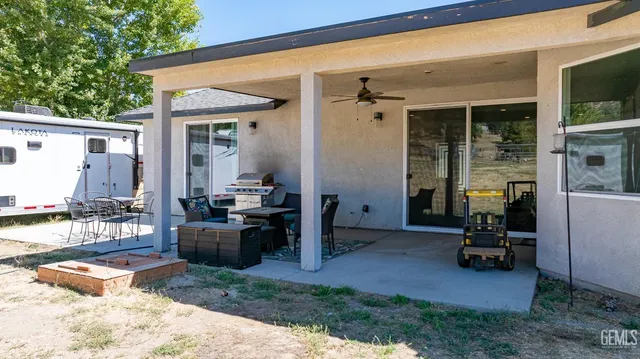 a view of living room filled with furniture and a patio