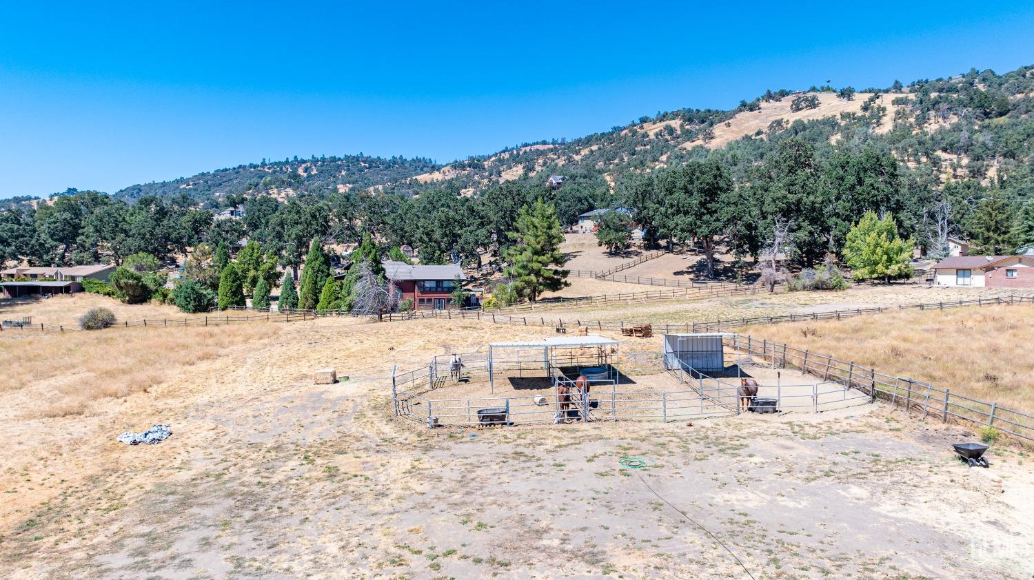 Undisclosed Address Tehachapi, CA 93561 - Photo 37 of 41 a view of swimming pool with lawn chairs and large trees