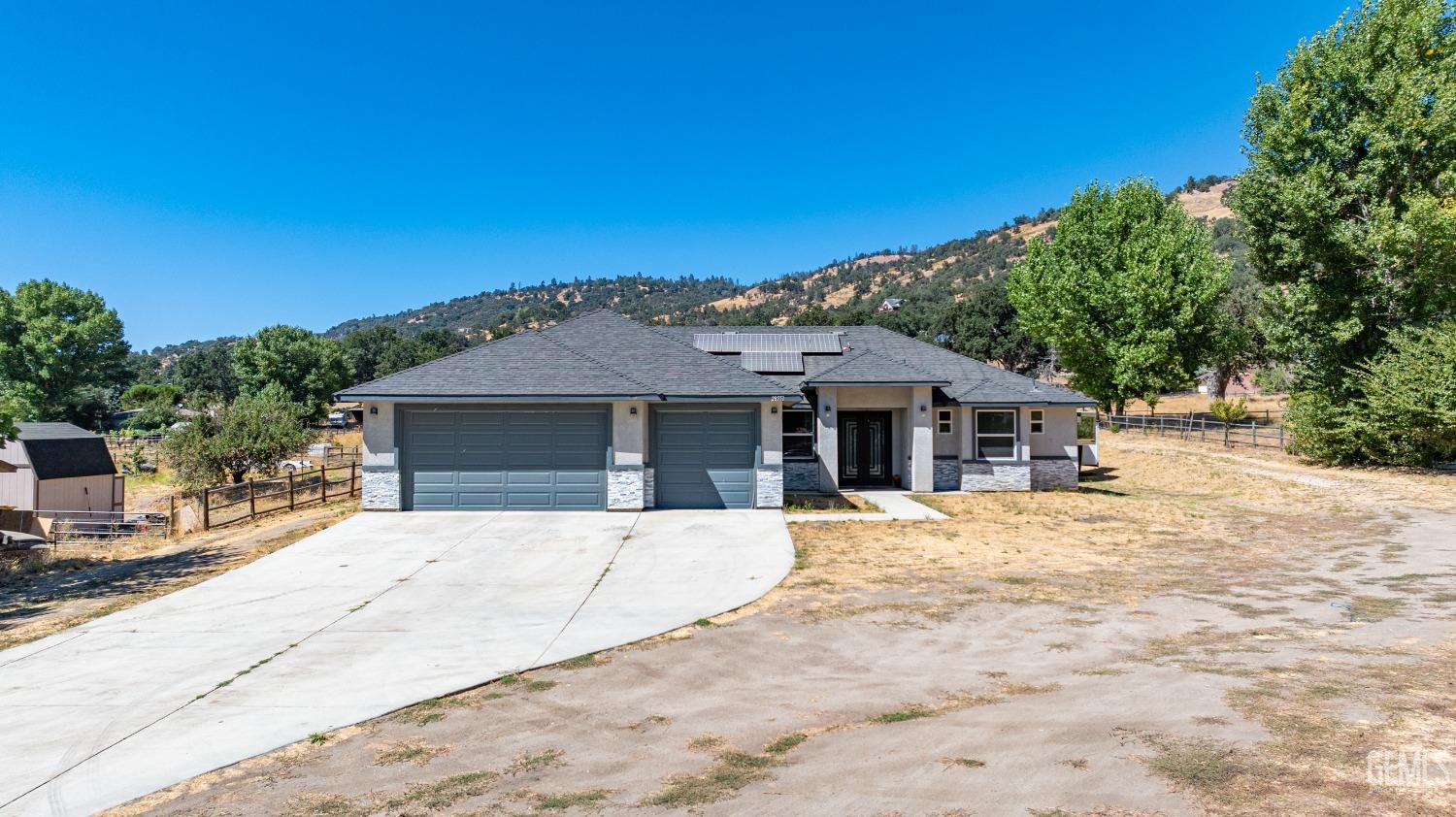 Undisclosed Address Tehachapi, CA 93561 - Photo 39 of 41 a front view of a house with a yard
