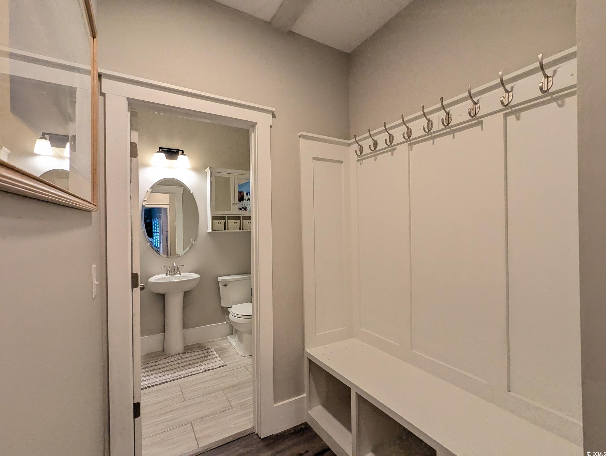 646 Pacific Commons Drive Surfside Beach, SC 29575 - Photo 25 of 40 Mudroom featuring dark wood-style floors and baseboards