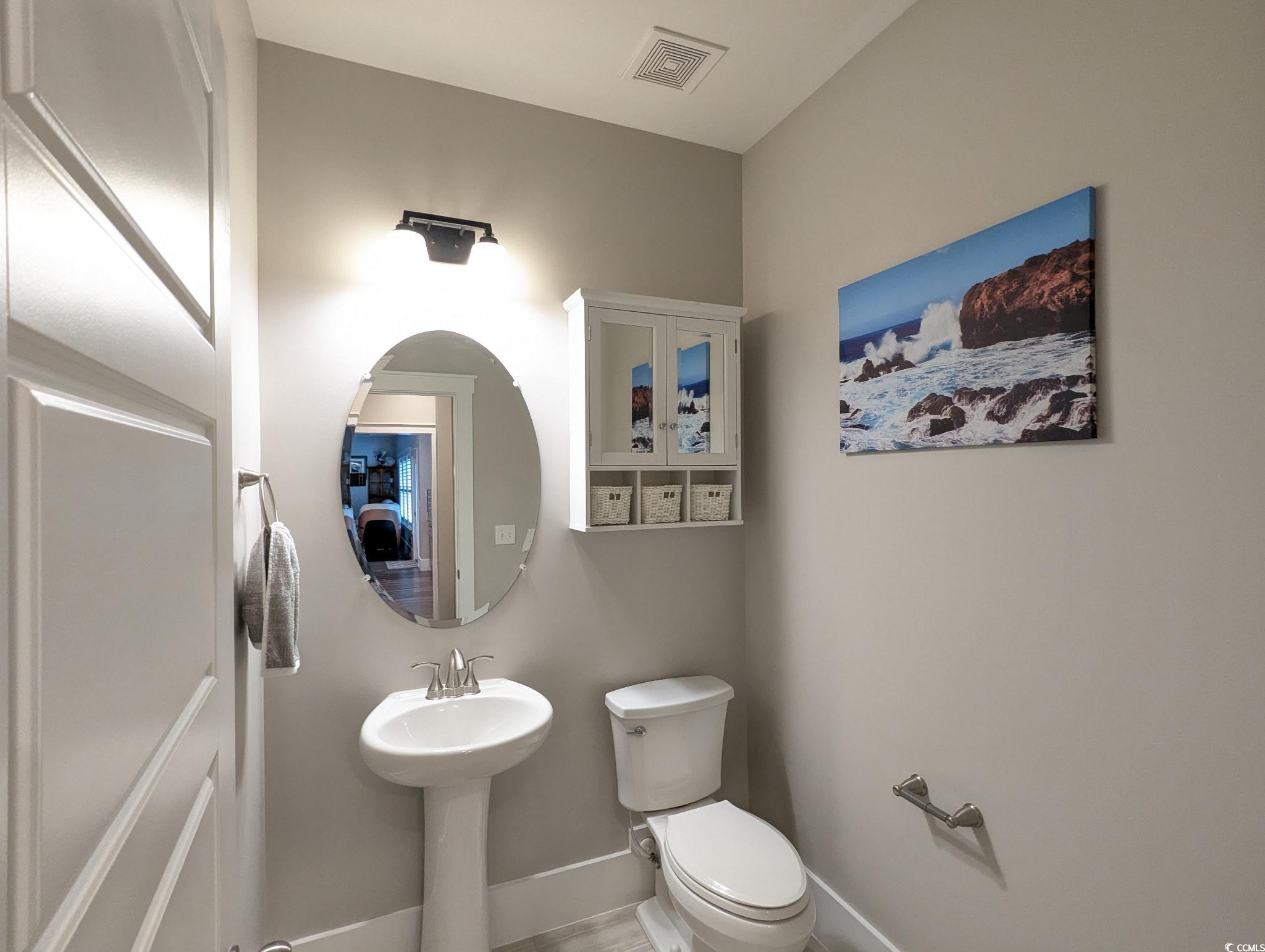 646 Pacific Commons Drive Surfside Beach, SC 29575 - Photo 26 of 40 Half bath featuring toilet and baseboards