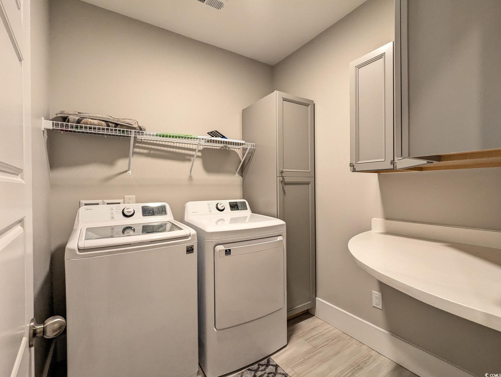 646 Pacific Commons Drive Surfside Beach, SC 29575 - Photo 27 of 40 Laundry room with washing machine and clothes dryer and light wood-style floors