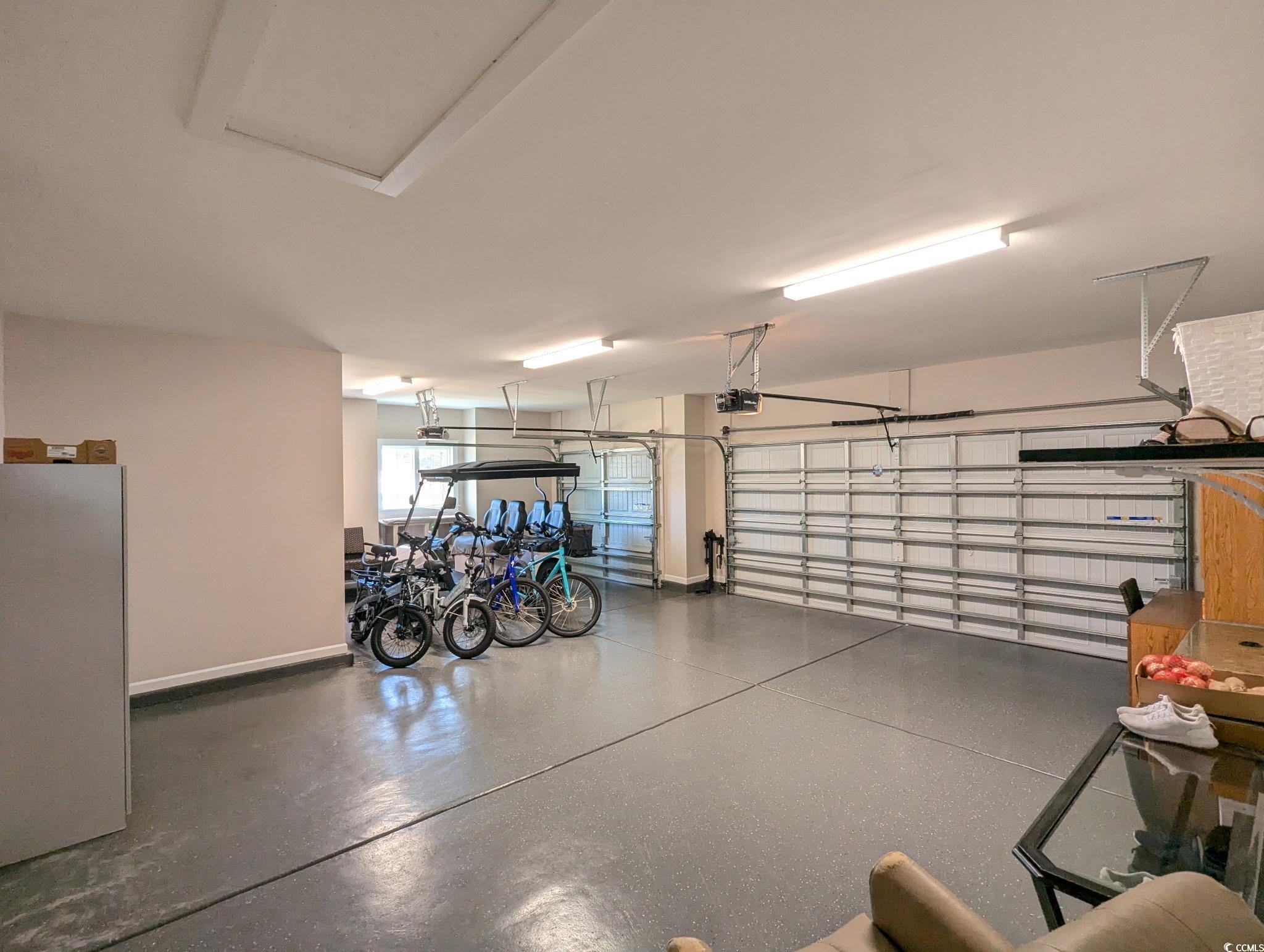 646 Pacific Commons Drive Surfside Beach, SC 29575 - Photo 28 of 40 Garage featuring baseboards