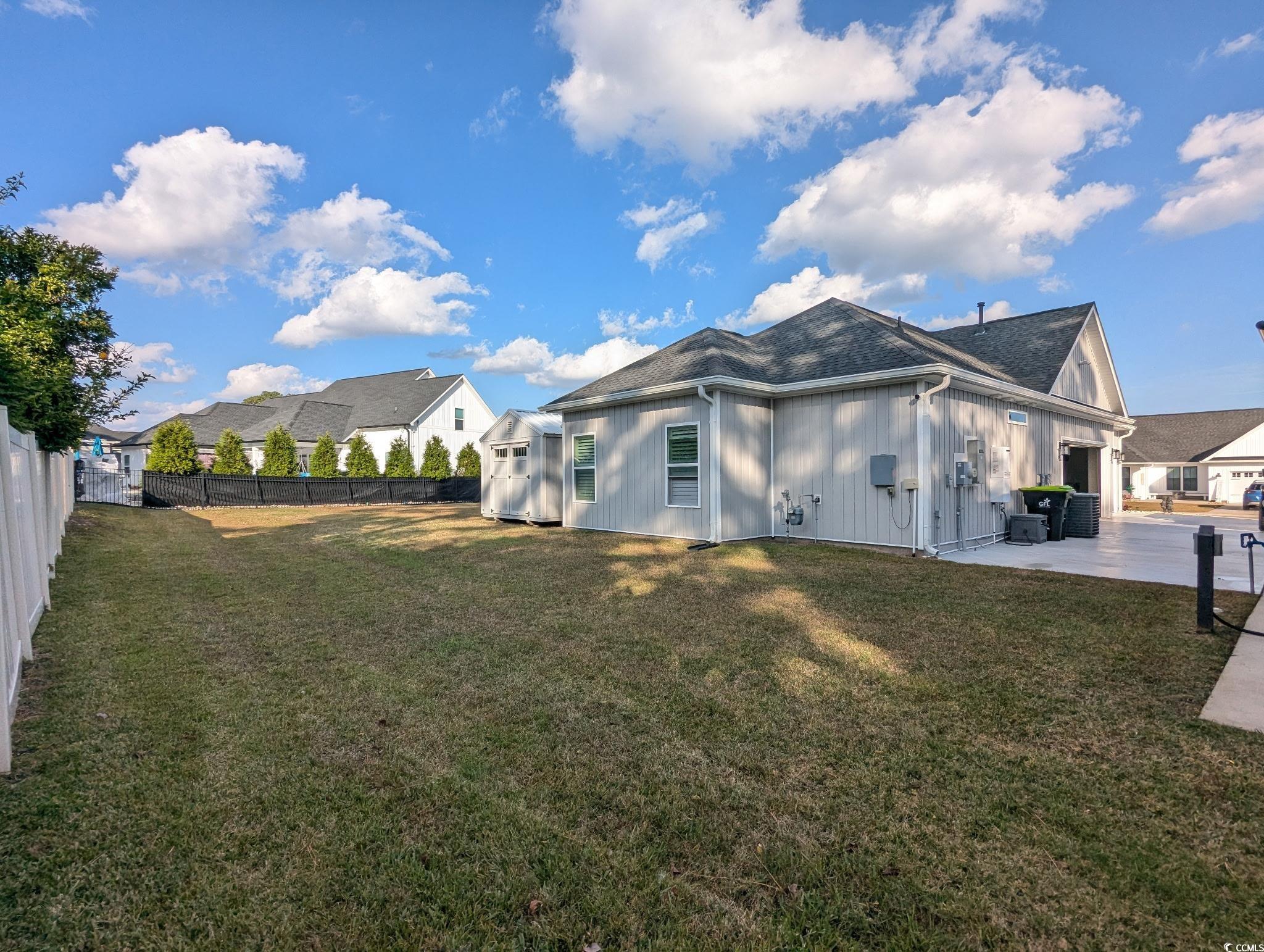 646 Pacific Commons Drive Surfside Beach, SC 29575 - Photo 31 of 40 View of property exterior featuring a fenced backyard