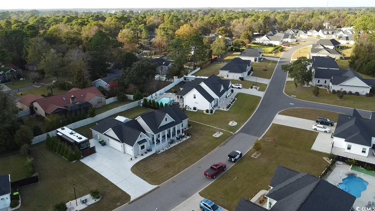 646 Pacific Commons Drive Surfside Beach, SC 29575 - Photo 38 of 40 Aerial view of property and surrounding area featuring nearby suburban area