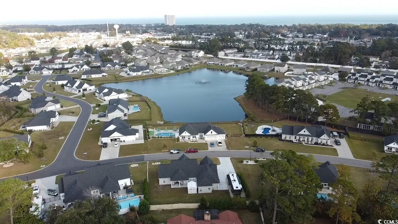 646 Pacific Commons Drive Surfside Beach, SC 29575 - Photo 39 of 40 Aerial overview of property's location featuring a large body of water and nearby suburban area