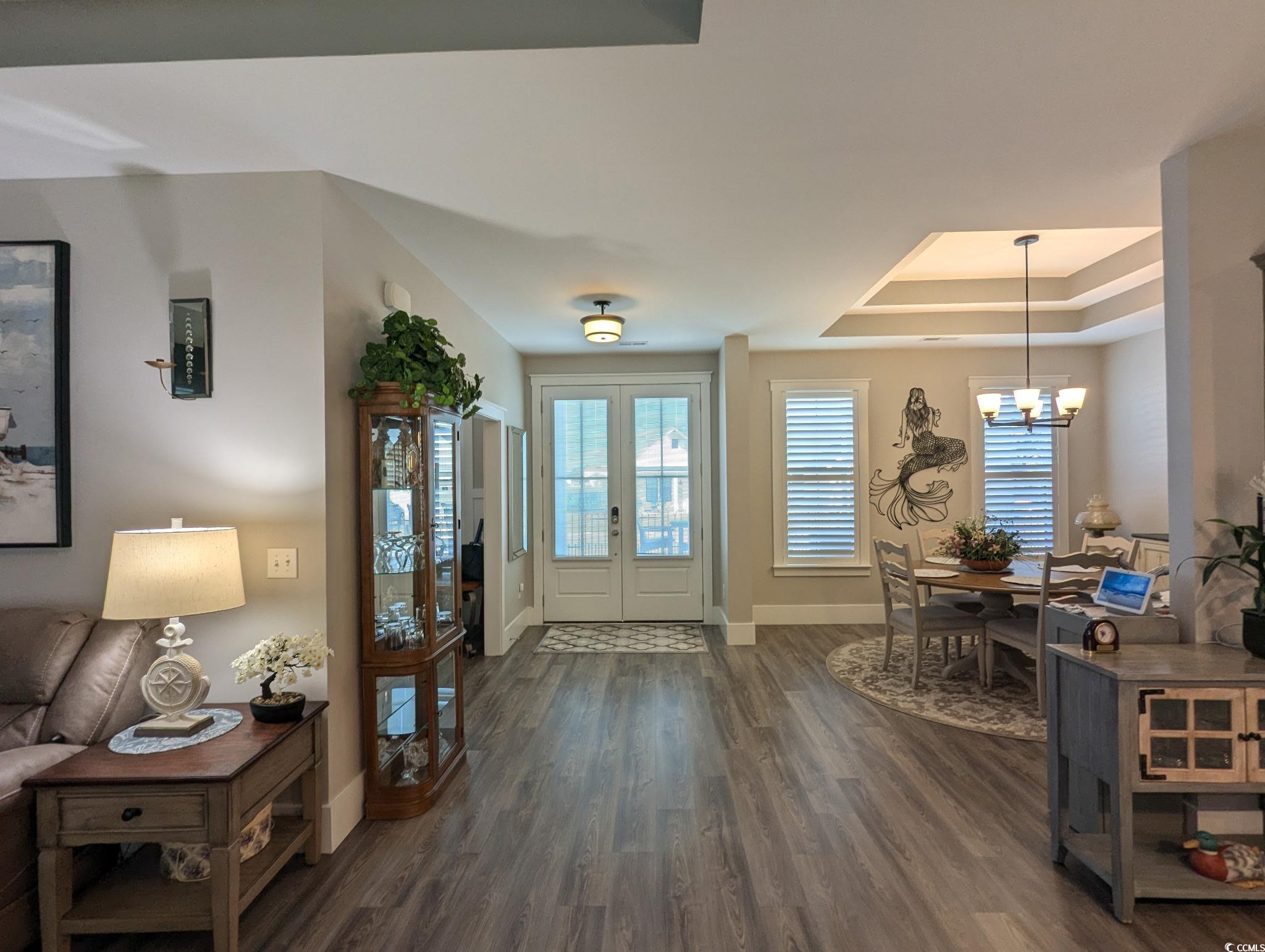 646 Pacific Commons Drive Surfside Beach, SC 29575 - Photo 4 of 40 Foyer with dark wood-style flooring, a raised ceiling, and a chandelier