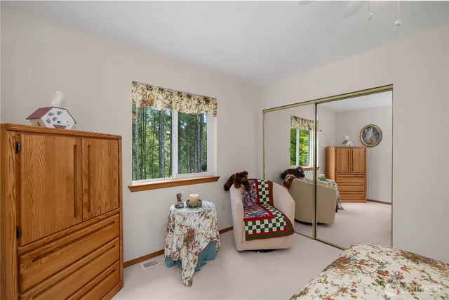 a bedroom with furniture and a window