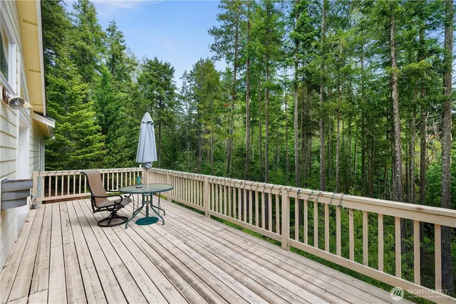 a view of balcony with furniture and trees