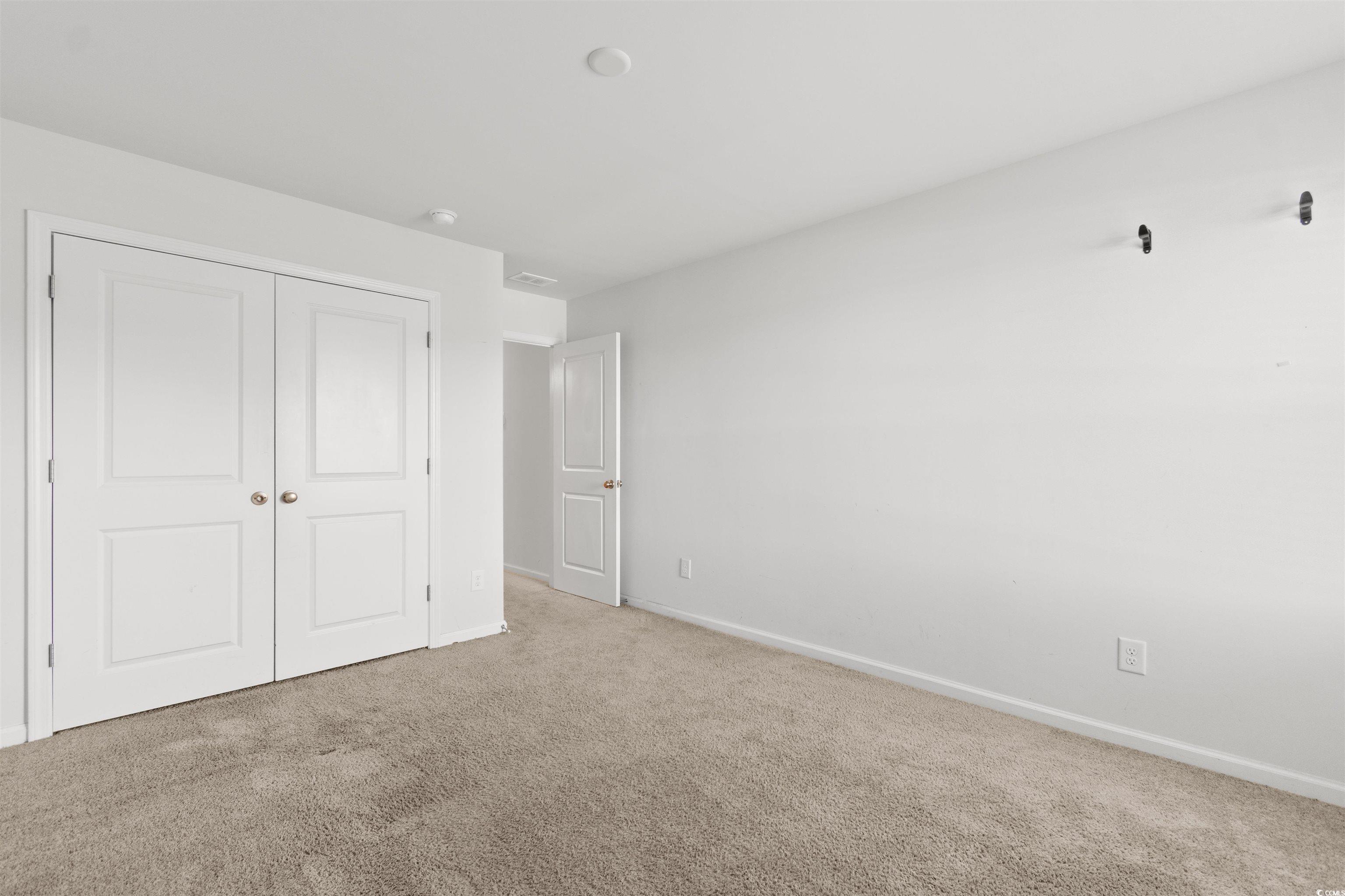 430 Stevia Court Conway, SC 29526 - Photo 29 of 40 Unfurnished bedroom with carpet floors and a closet