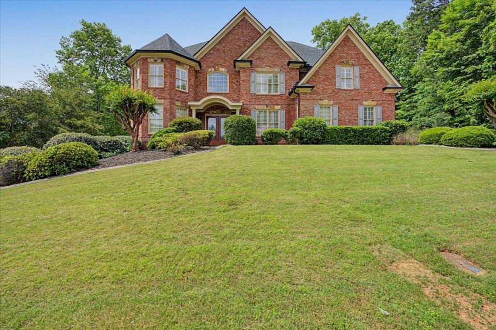 122 Ridge View Drive Ball Ground, GA 30107 - Photo 4 of 84 a front view of a house with yard and green space