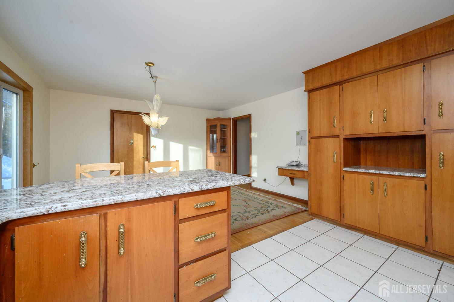 1821 Englishtown Road Old Bridge, NJ 08857 - Photo 14 of 46 a kitchen with stainless steel appliances granite countertop a sink and a refrigerator