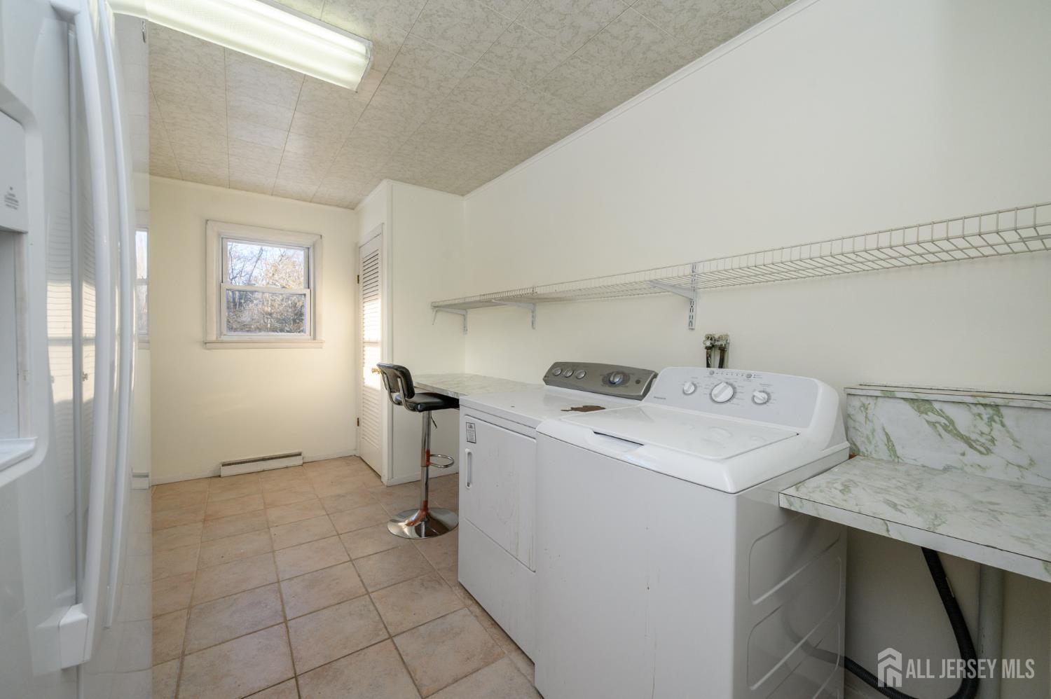 1821 Englishtown Road Old Bridge, NJ 08857 - Photo 18 of 46 a utility room with dryer and washer