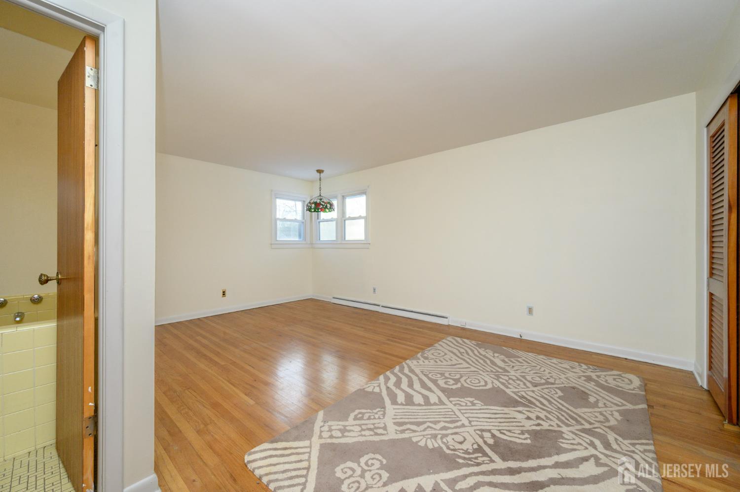 1821 Englishtown Road Old Bridge, NJ 08857 - Photo 21 of 46 a view of an empty room and window