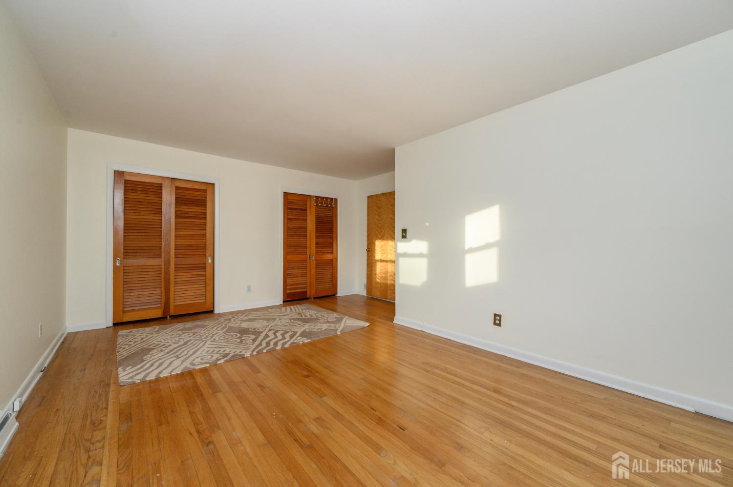1821 Englishtown Road Old Bridge, NJ 08857 - Photo 22 of 46 wooden floor in an empty room