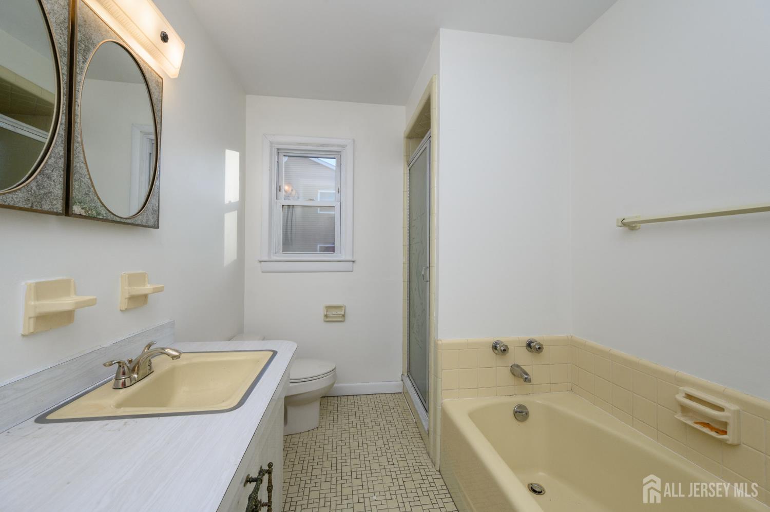 1821 Englishtown Road Old Bridge, NJ 08857 - Photo 24 of 46 a bathroom with a sink and a bathtub