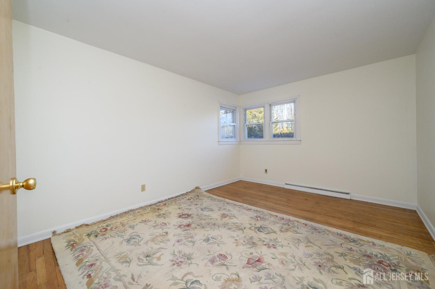 1821 Englishtown Road Old Bridge, NJ 08857 - Photo 25 of 46 an empty room with a window