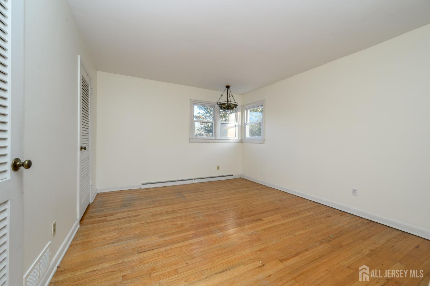 1821 Englishtown Road Old Bridge, NJ 08857 - Photo 27 of 46 wooden floor in an empty room