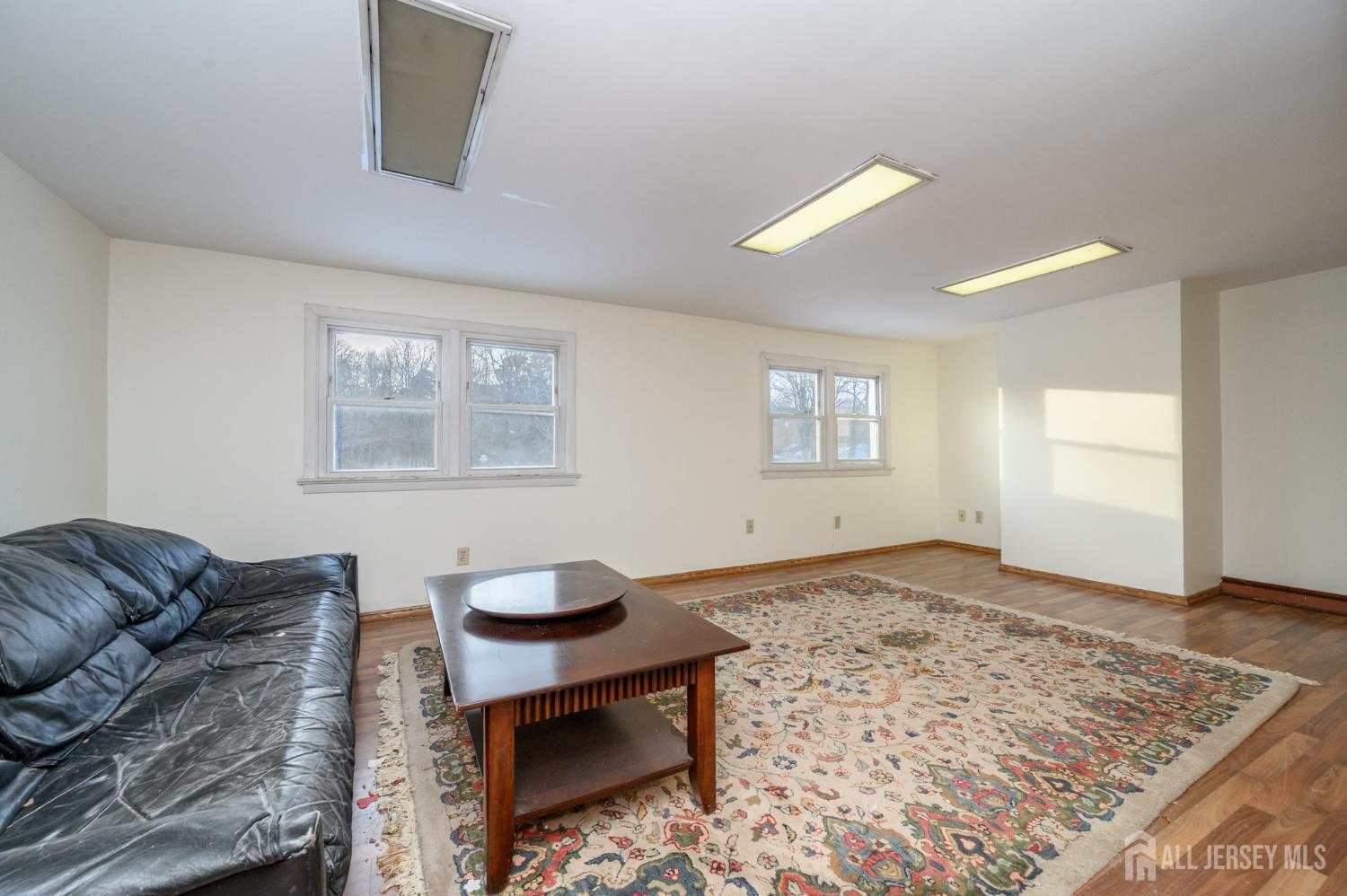 1821 Englishtown Road Old Bridge, NJ 08857 - Photo 29 of 46 a living room with furniture and a rug