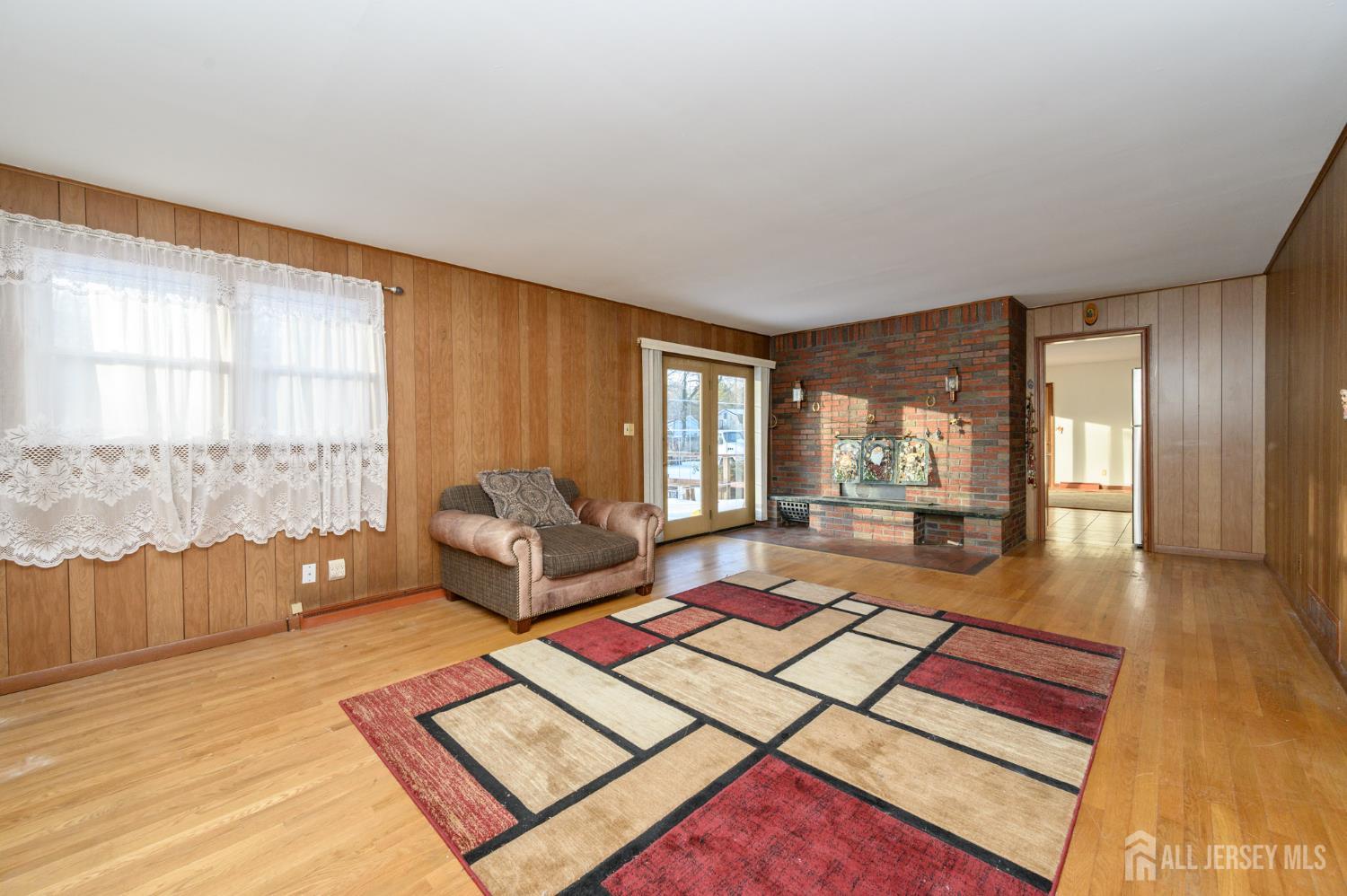 1821 Englishtown Road Old Bridge, NJ 08857 - Photo 7 of 46 a living room with furniture and a table