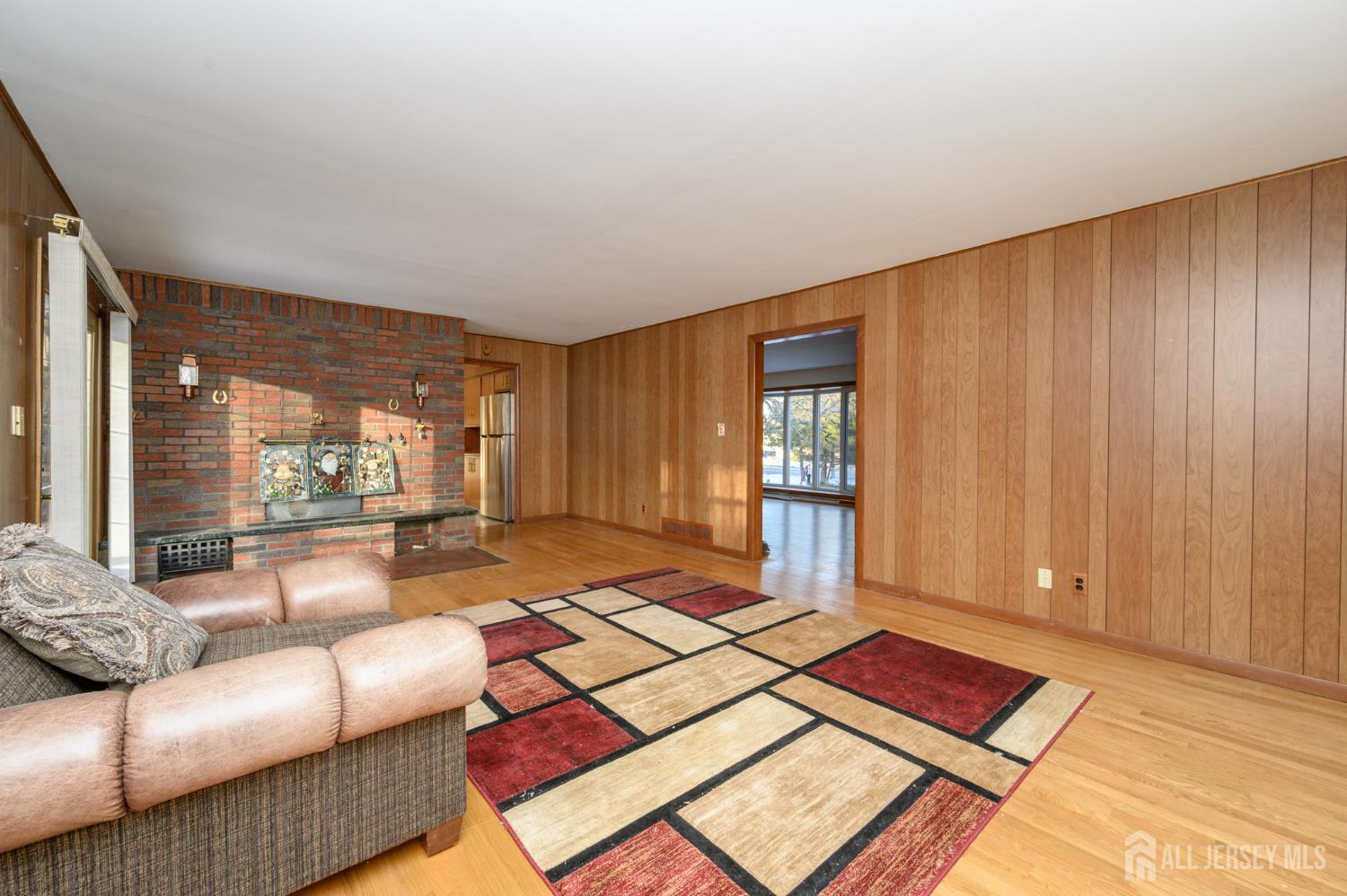 1821 Englishtown Road Old Bridge, NJ 08857 - Photo 8 of 46 a living room with a couch and a window