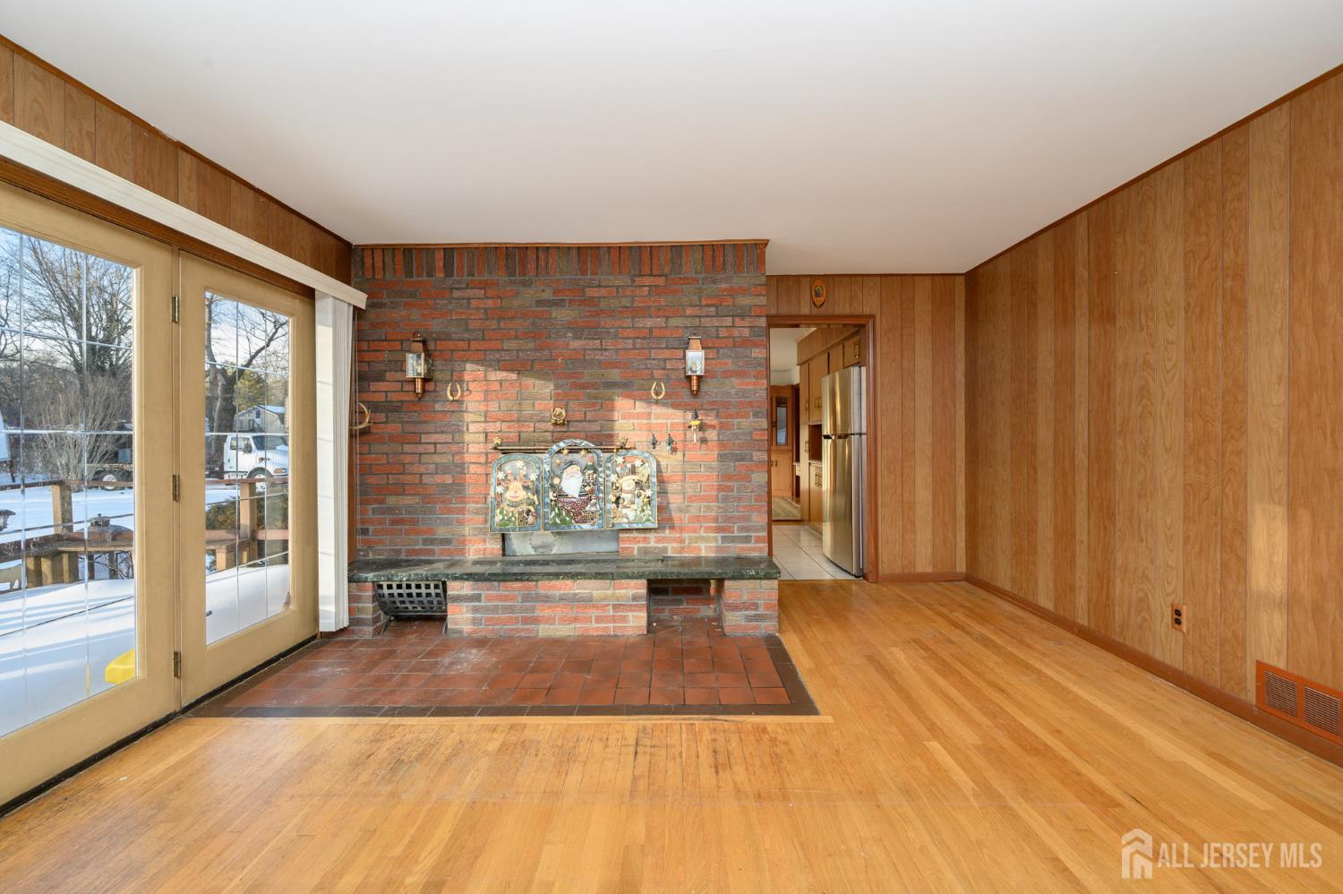 1821 Englishtown Road Old Bridge, NJ 08857 - Photo 9 of 46 a view of a room with wooden floor and a window