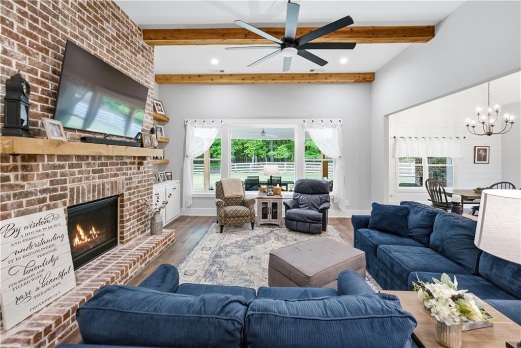 3584 Stock Road Monroe, GA 30656 - Photo 12 of 80 a living room with furniture and a fireplace