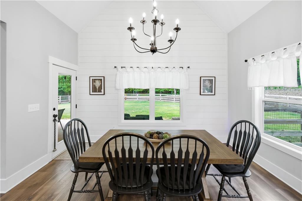 3584 Stock Road Monroe, GA 30656 - Photo 18 of 80 a view of a dining room with furniture window and wooden floor