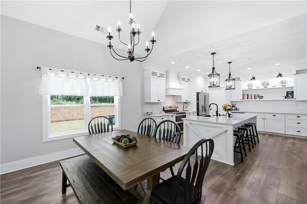 3584 Stock Road Monroe, GA 30656 - Photo 21 of 80 a view of a dining room with furniture window and wooden floor