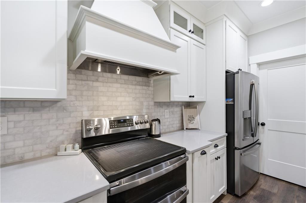 3584 Stock Road Monroe, GA 30656 - Photo 26 of 80 a kitchen with stainless steel appliances granite countertop a refrigerator a stove and a sink