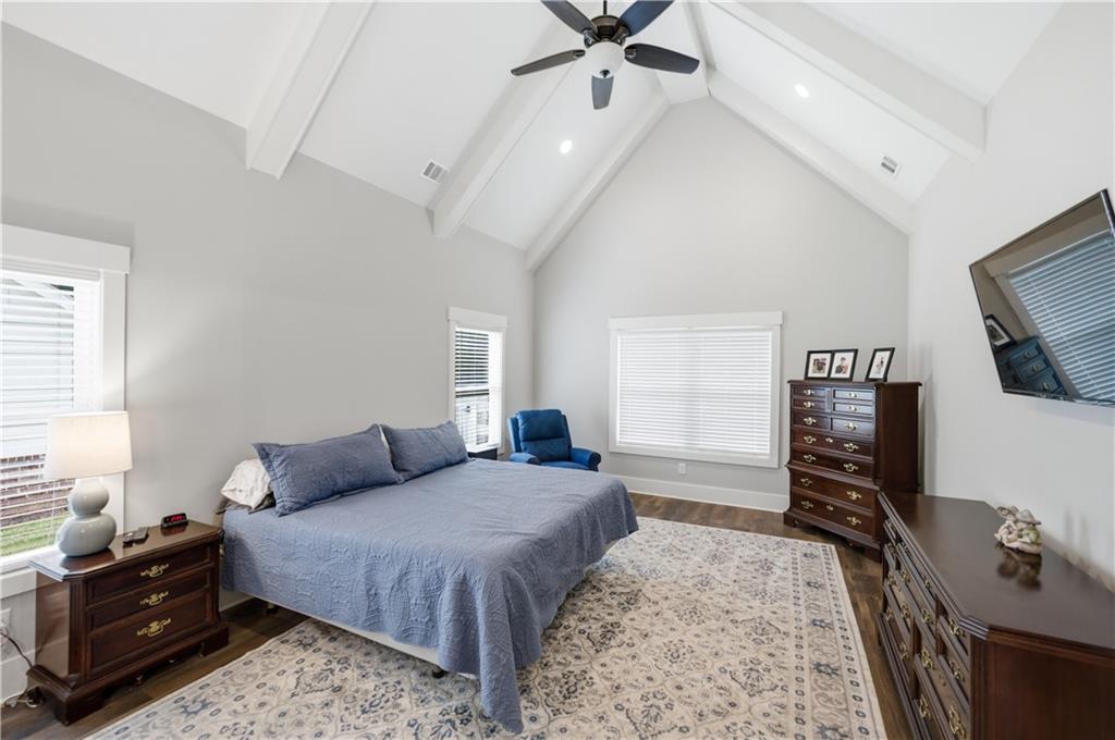 3584 Stock Road Monroe, GA 30656 - Photo 36 of 80 a bedroom with a bed and a flat tv screen on dresser